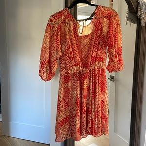 Mini dress with spaghetti strap orange lining sewn in with adjustable belt/cinch